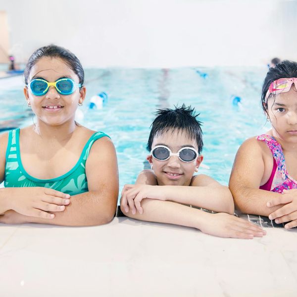 Person smiling peacefully outdoors, feeling refreshed and energetic.